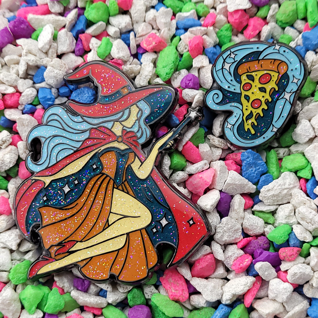 A 2 pin set. One pin is a witch with a wand. The other is a slice of pizza with pepperoni and basil being conjured in a cloud of magic.